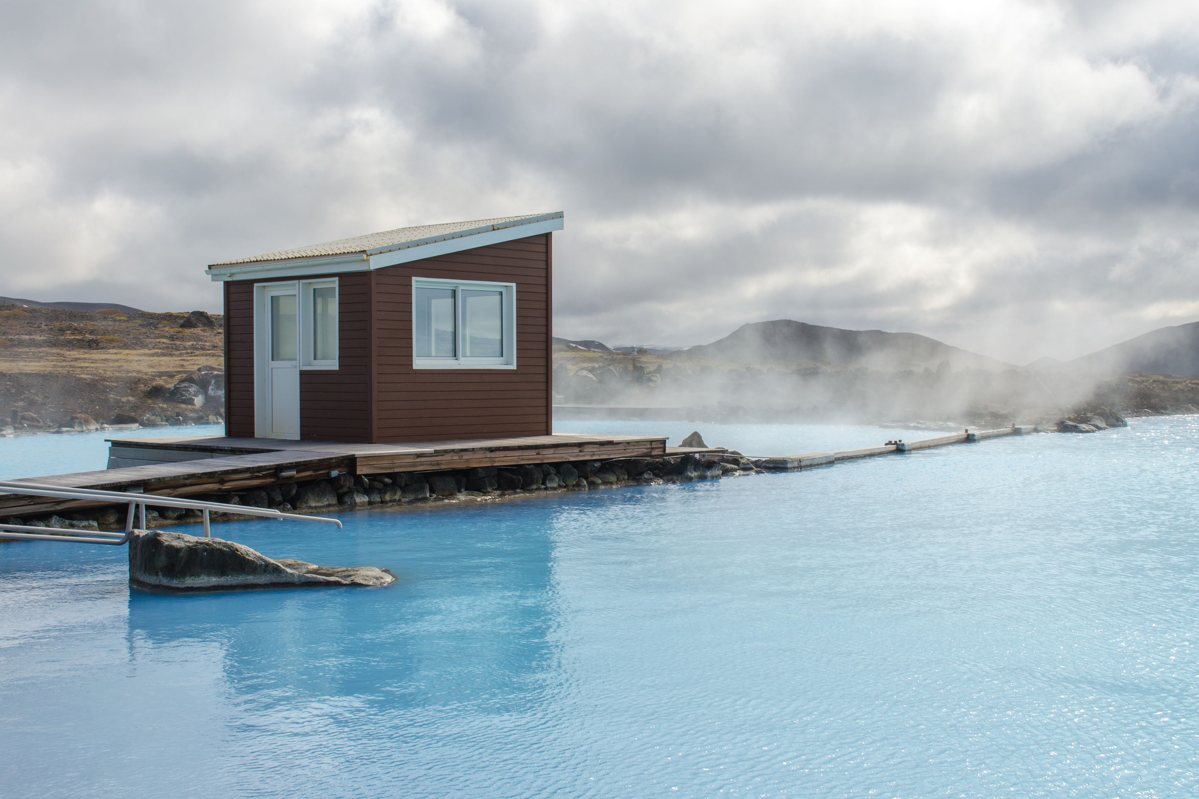 A natural bath in Iceland with blue water 
