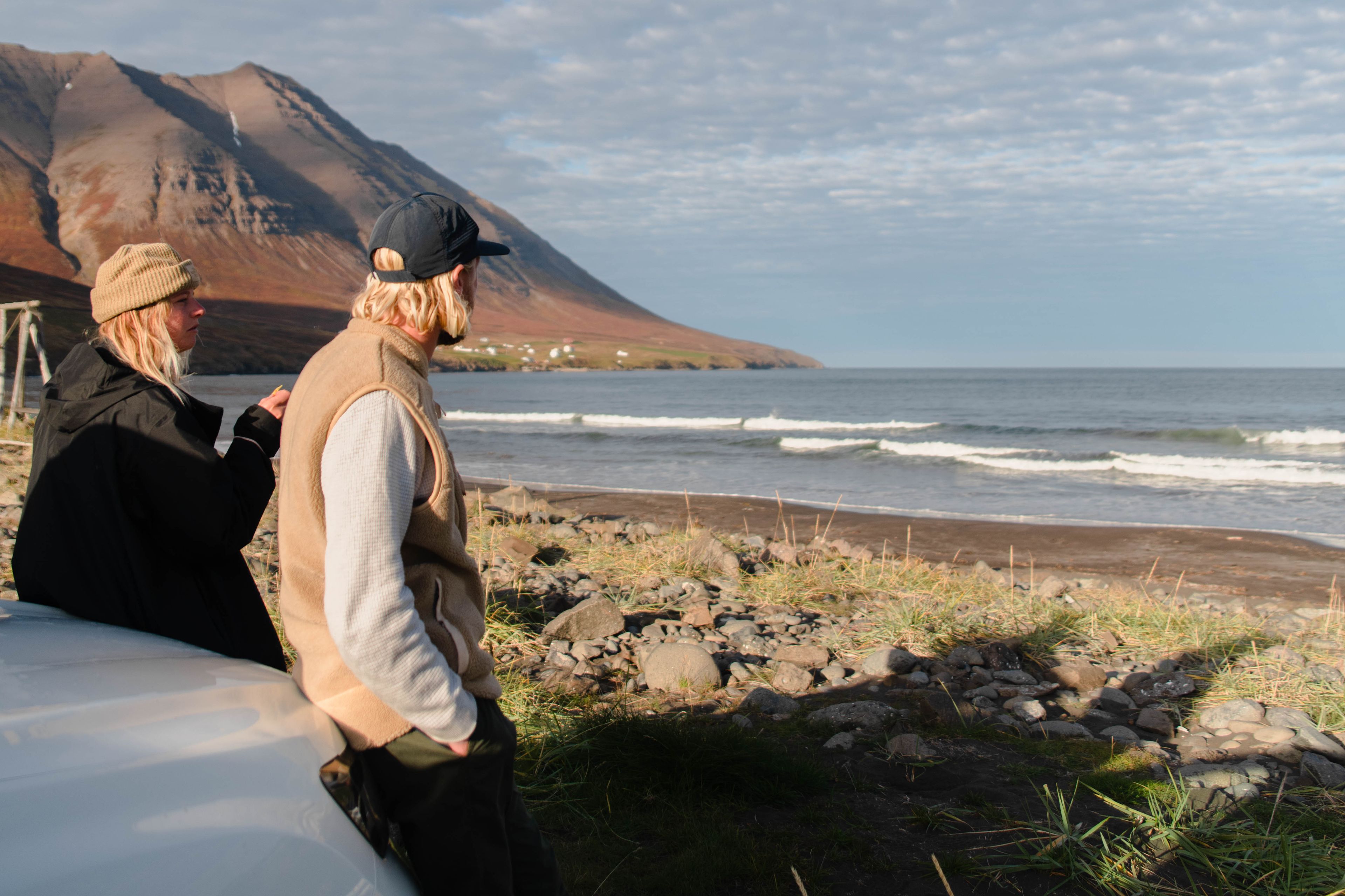 a woman and a man watching the Icelandic landscape in the spring
