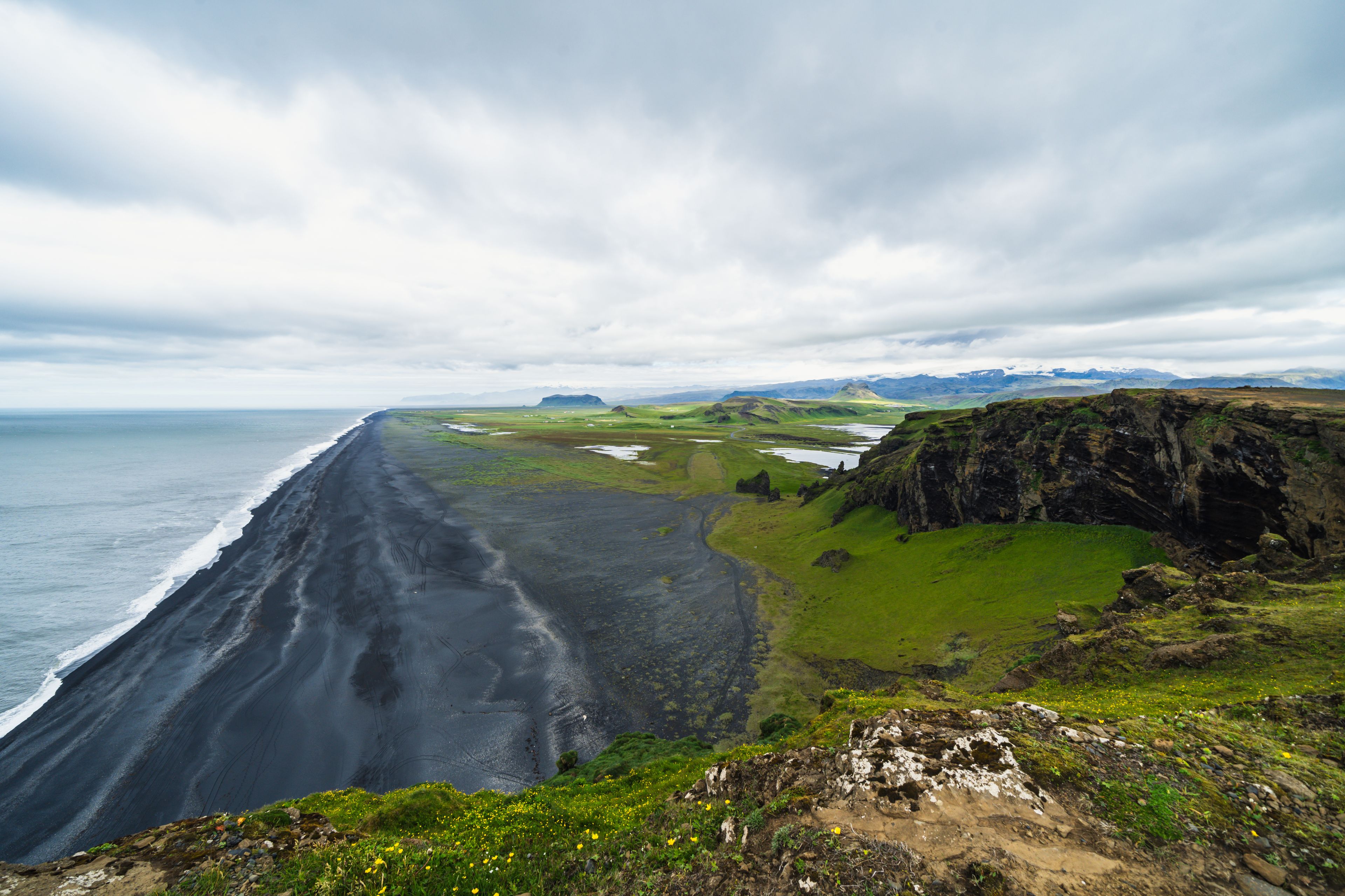 Aerial view of a black sand beach from Dyrholaey Peninsula