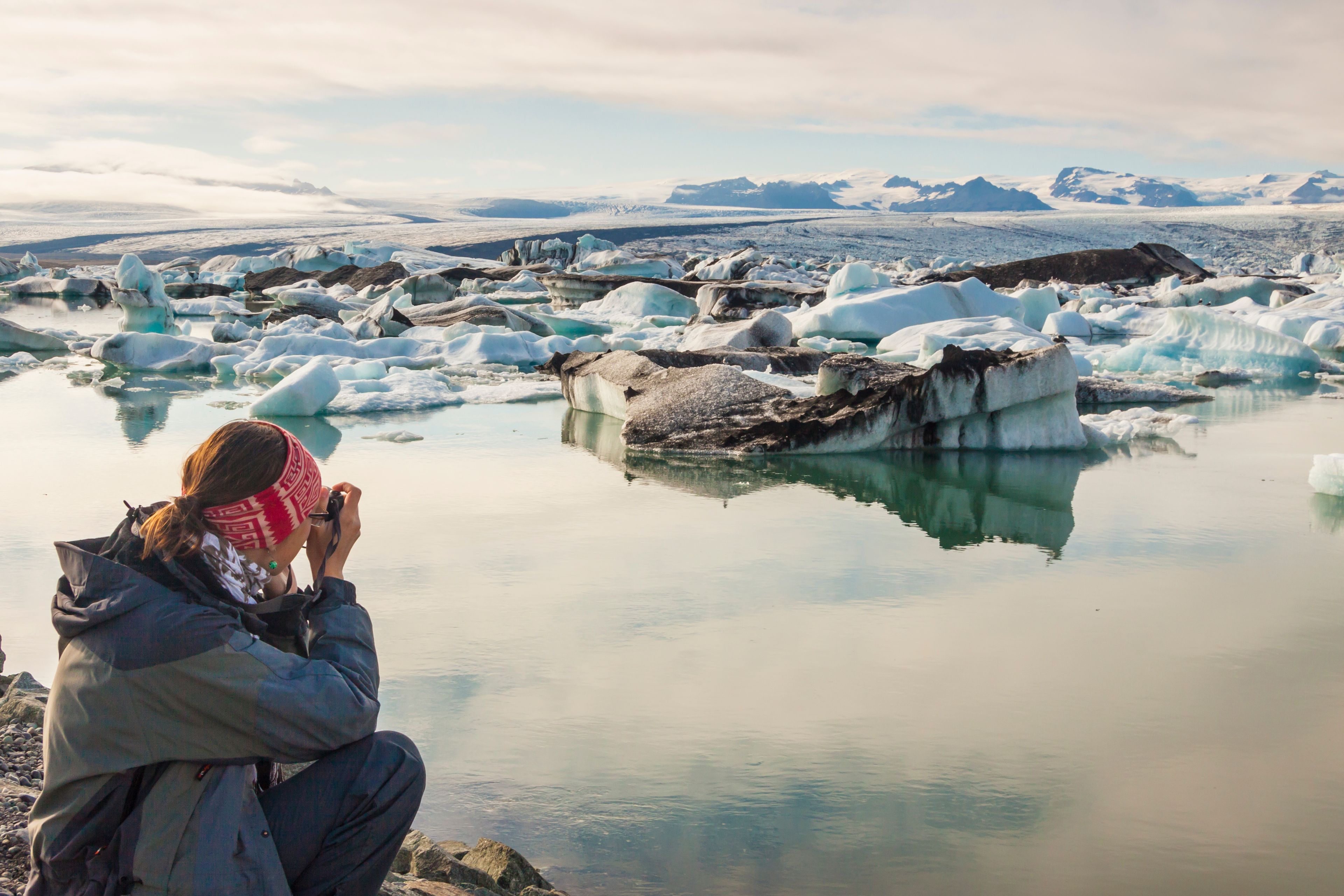 Girl taking pictures at Jökulsárlón