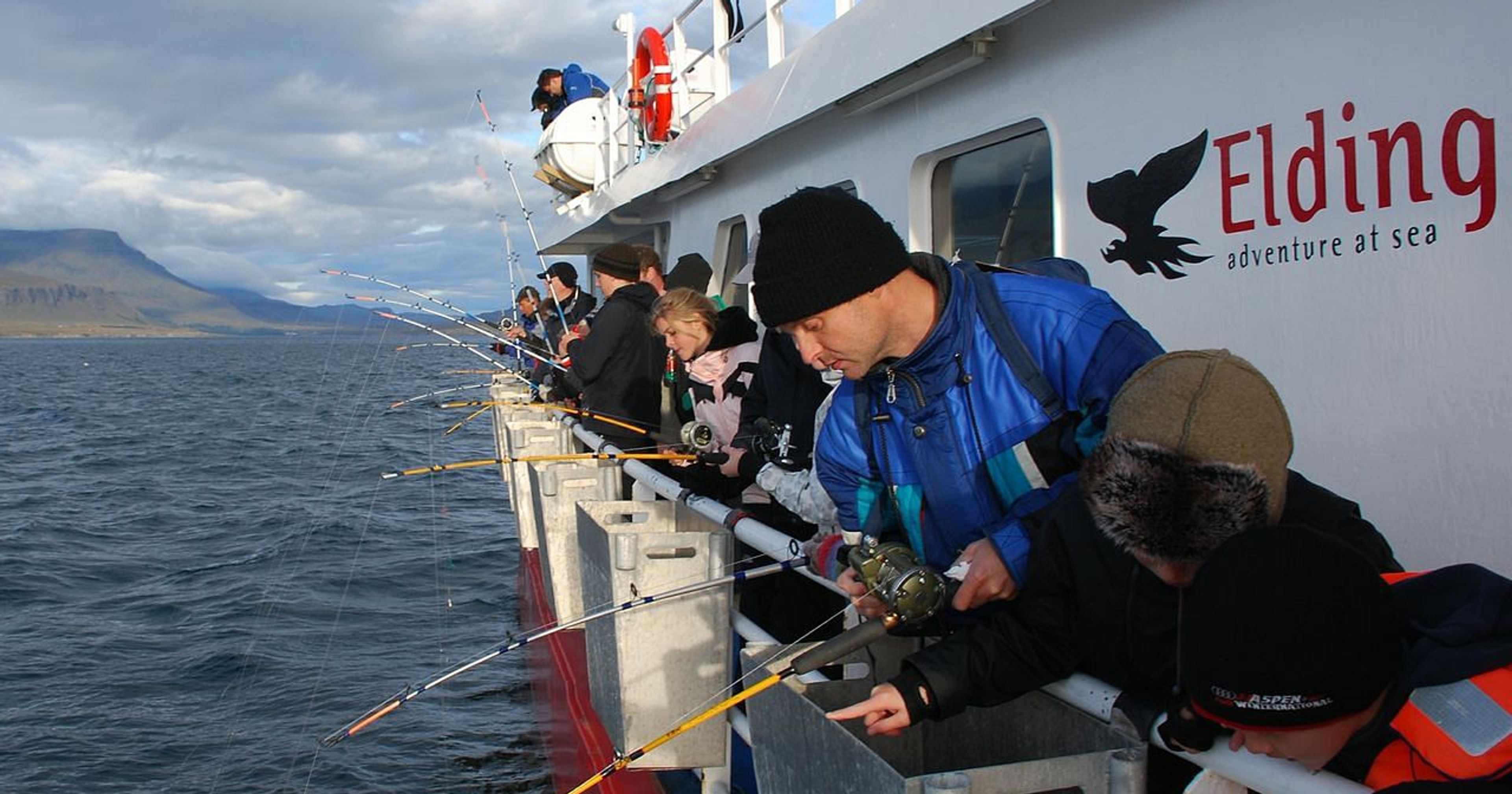 a group of people went out to sea to fish, excursion in Iceland 