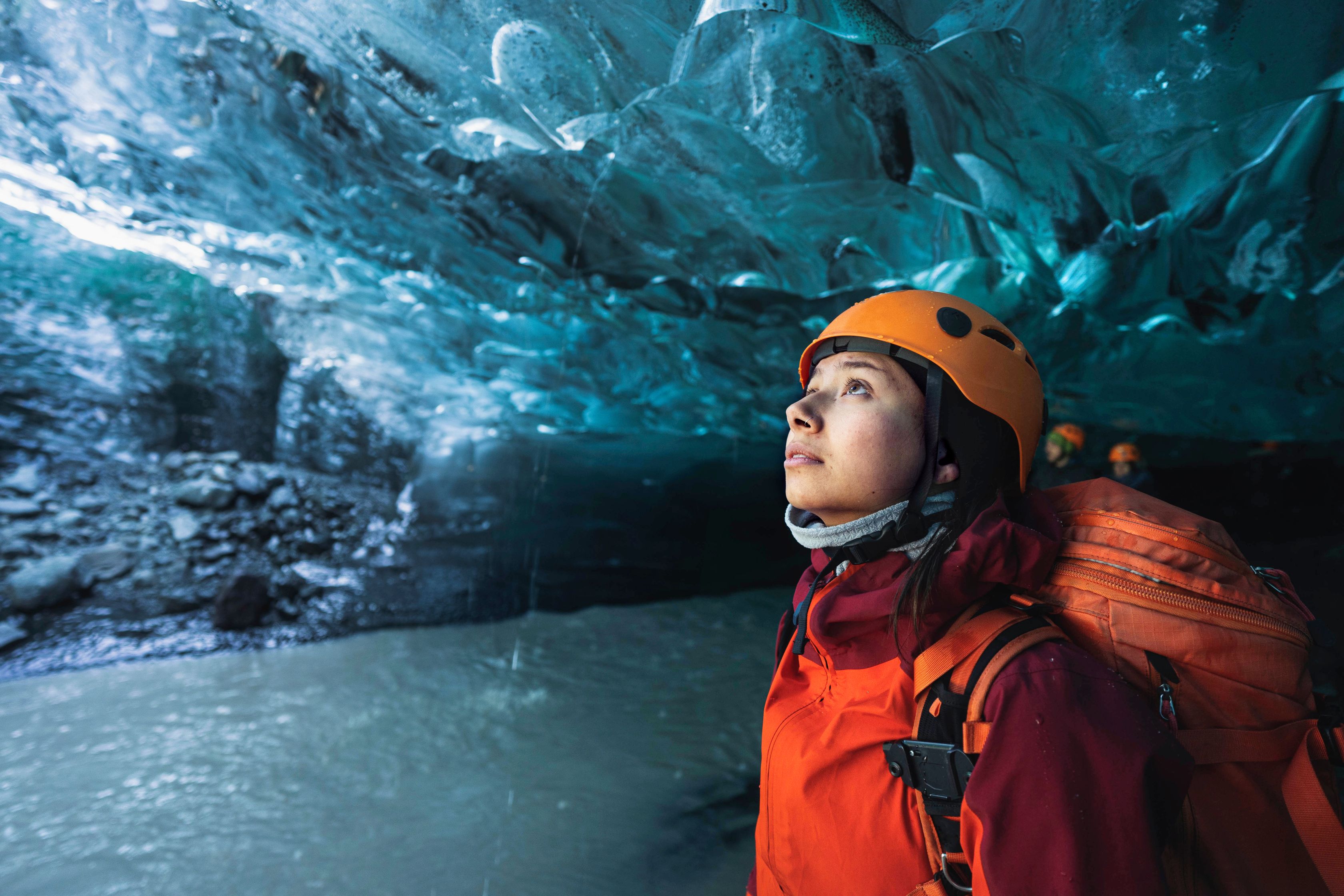 ice caving during march in iceland, off season with sturdy hiking boots.