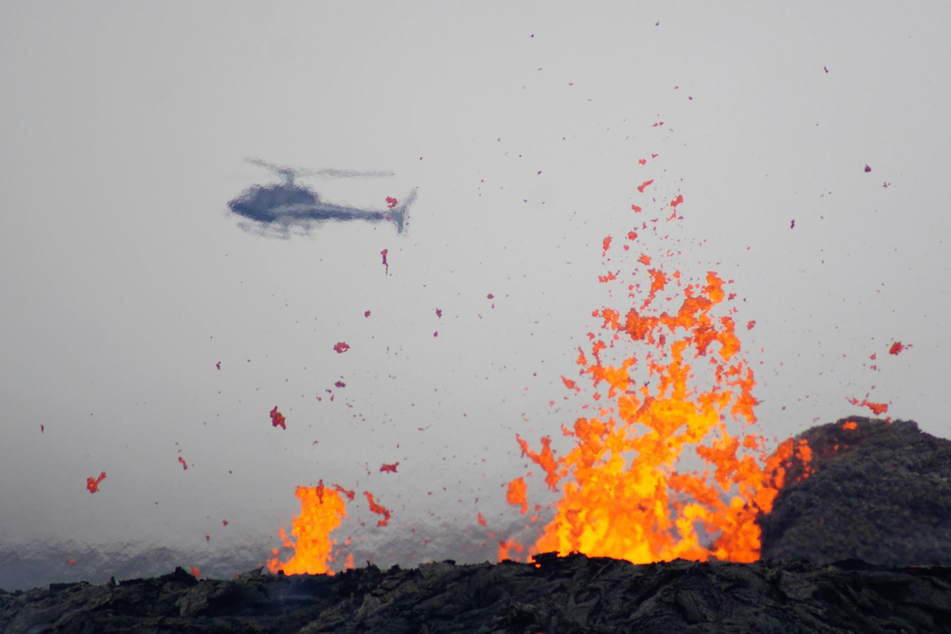 the Fagradalsfjall eruption with an helicopter in the background