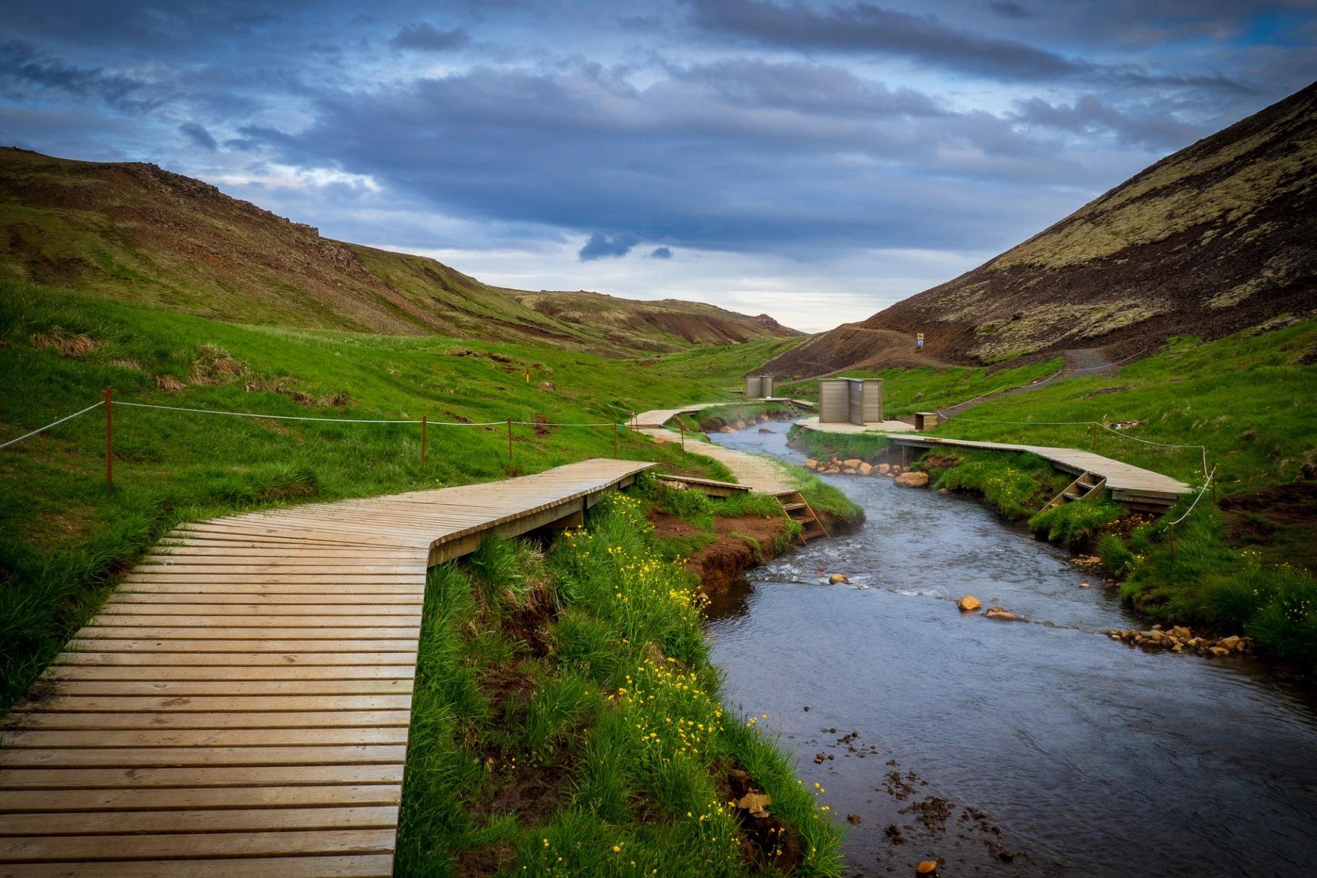 Reykjadalur hot spring, thermal river and its green landscape
