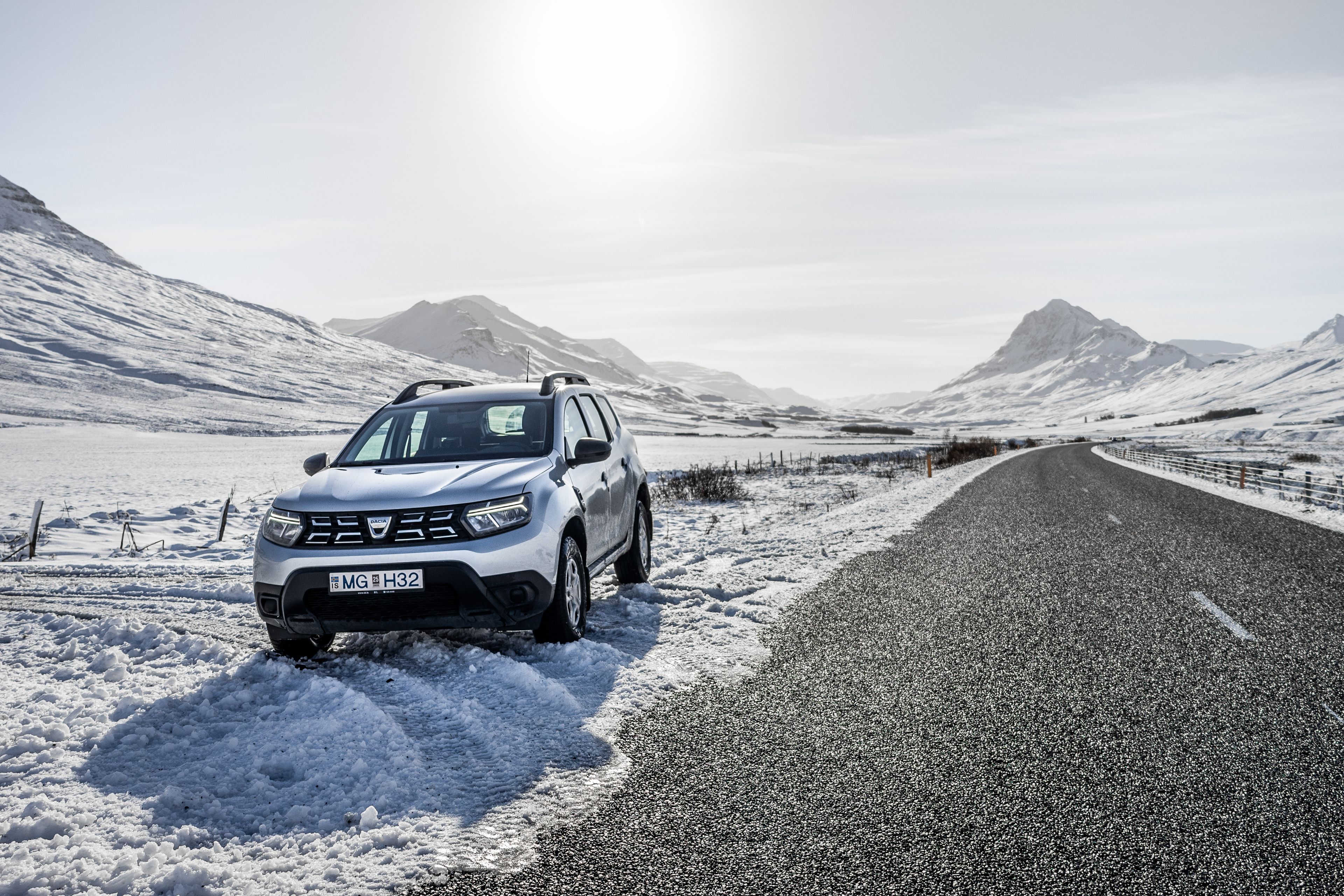 A dacia Duster parked on a road in winter in Iceland 