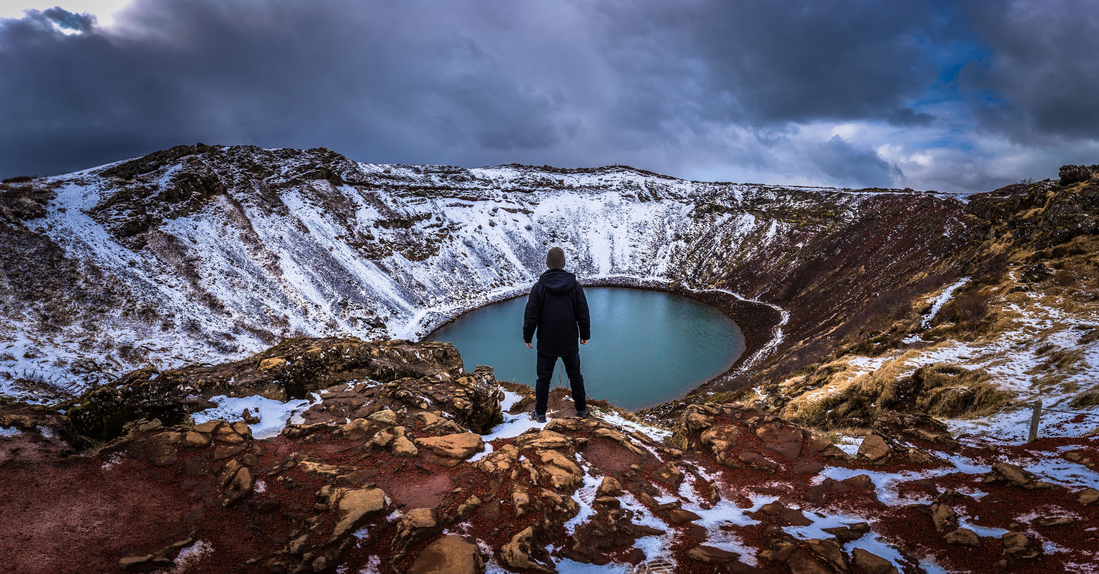 Man in front of Kerid Crater, Iceland