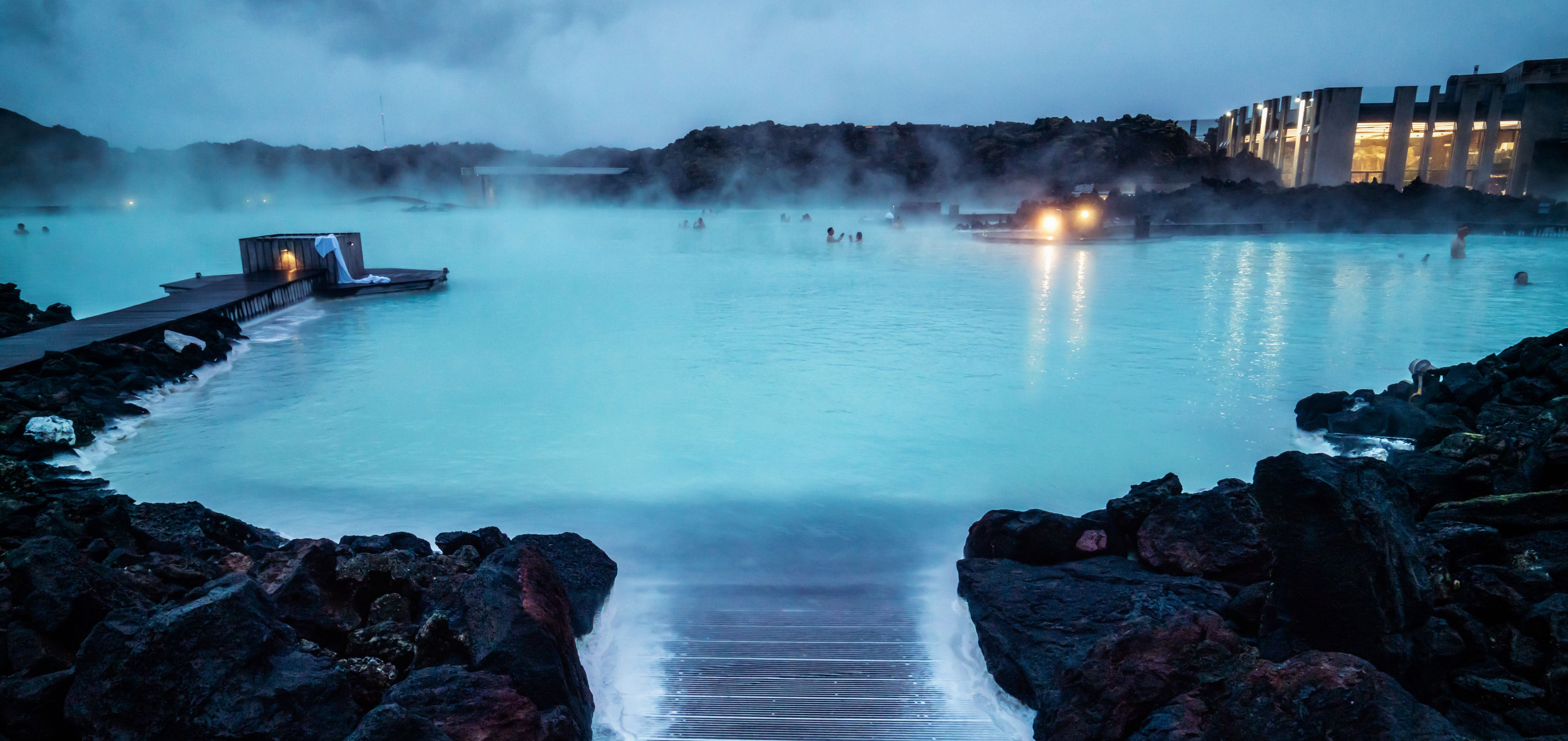 Aerial view of the Blue Lagoon in Iceland with people swimming in the warm waters