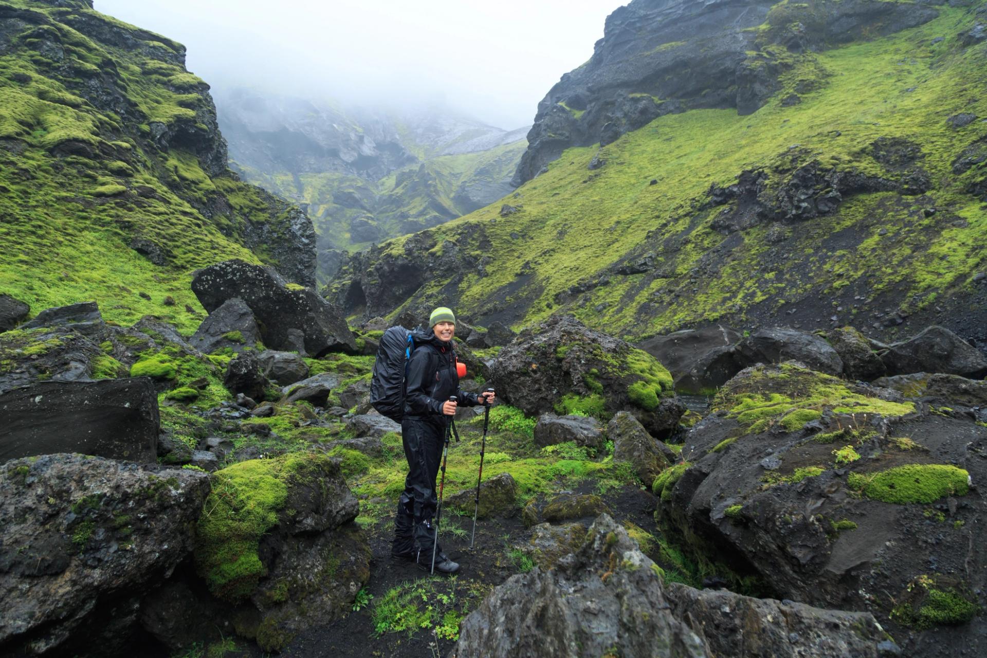 Hiker walking on a trail in Iceland's glacial river canyons