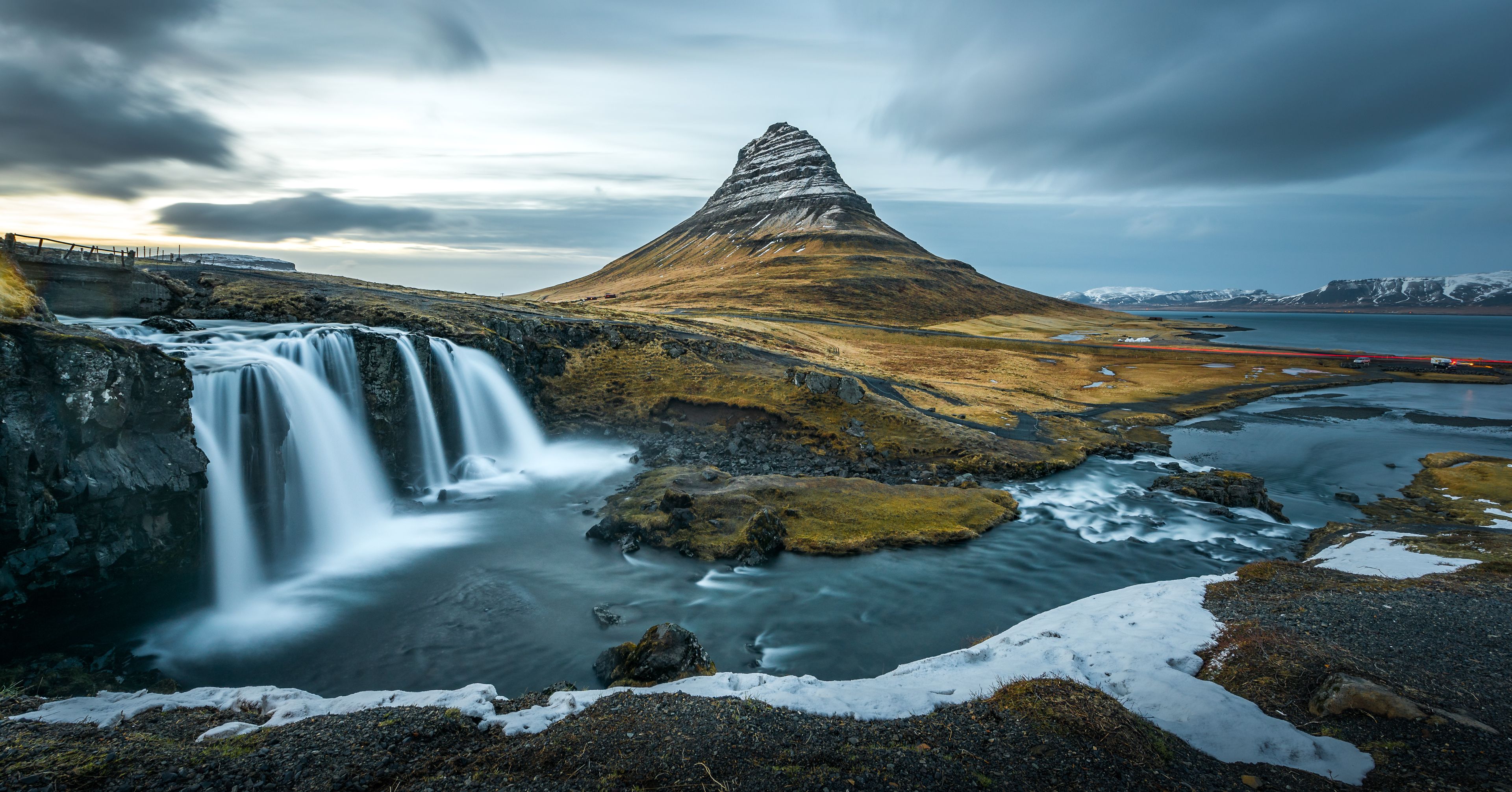 Kirkjufellsfoss with background of remarkable mountain during month of April