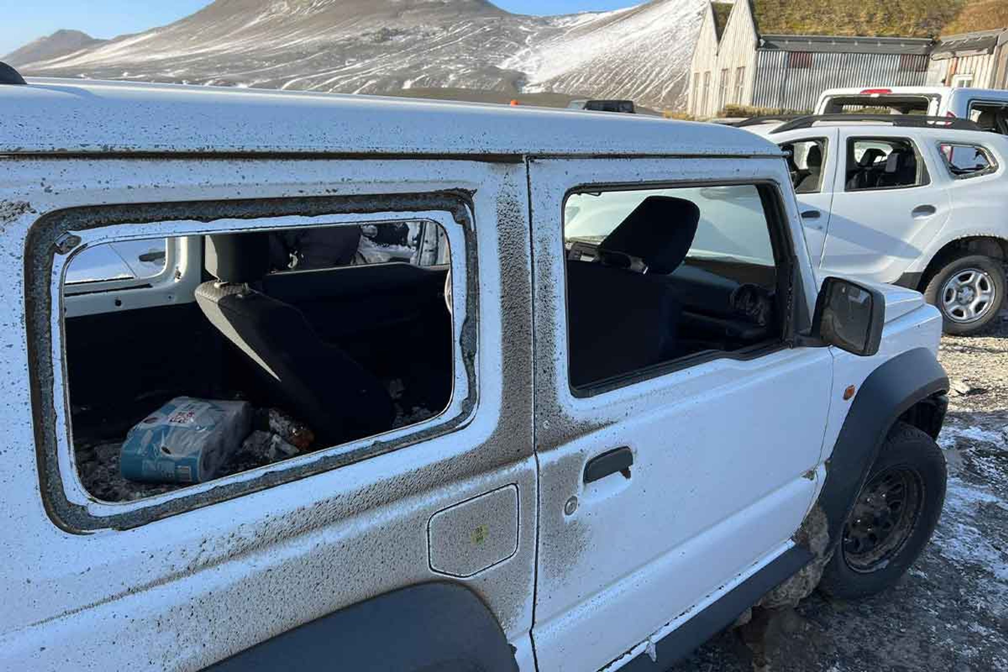 Sand and ash damaged windows on a Suzuki jimny iceland rental car