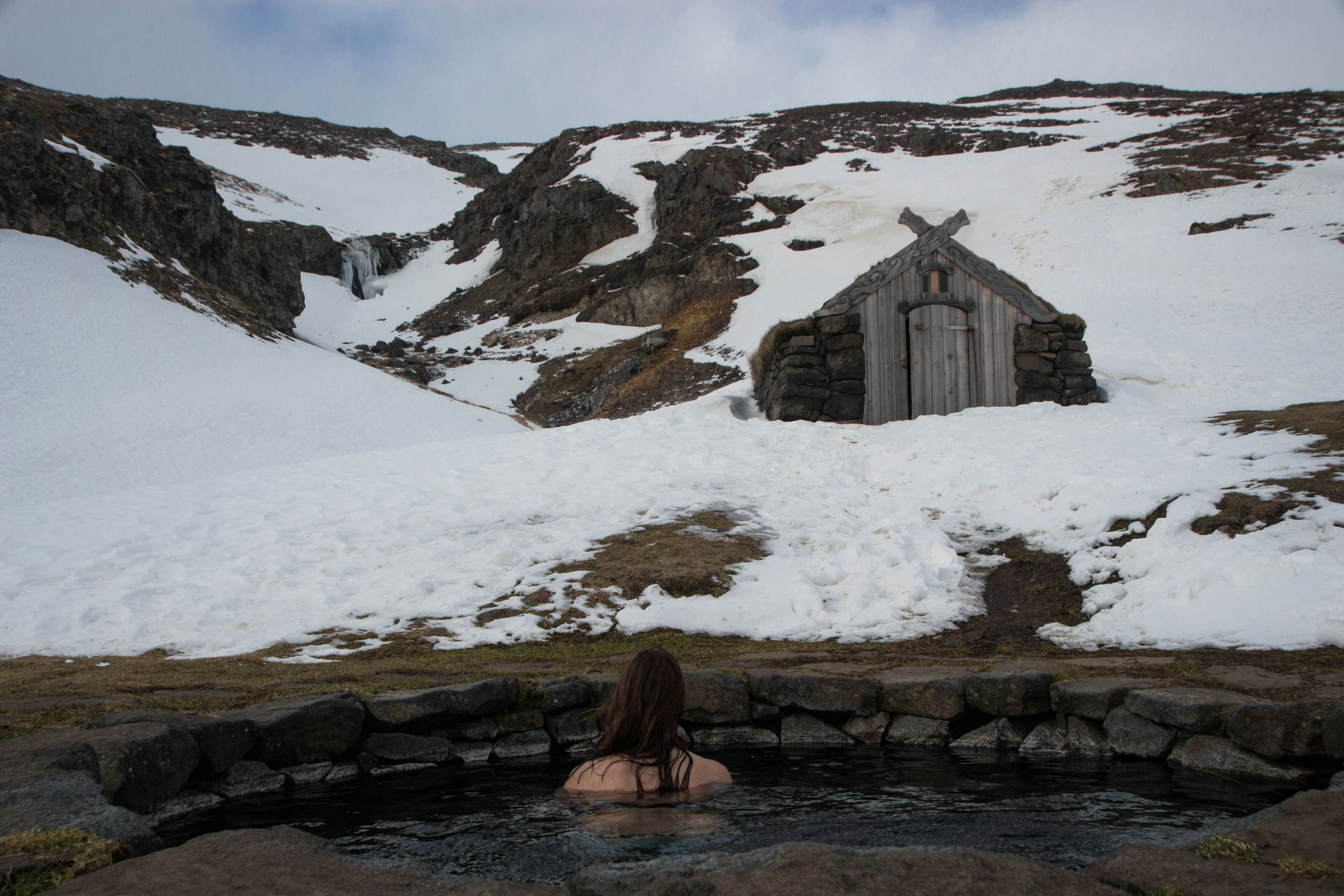 Girl inside Guðrúnarlaug during winter