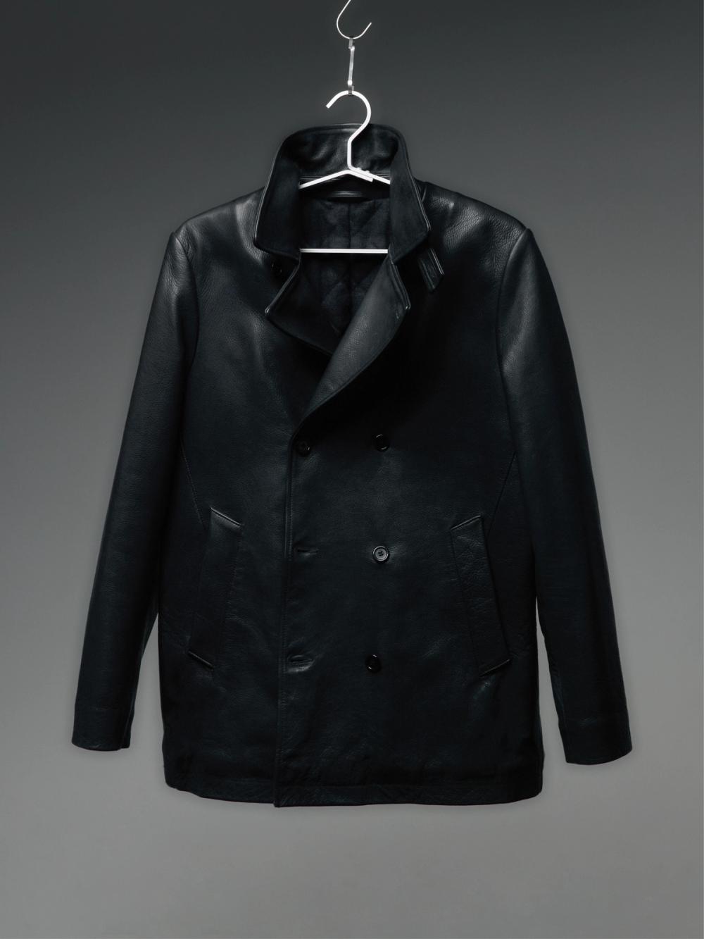 Black leather double-breasted jacket on a hanger.