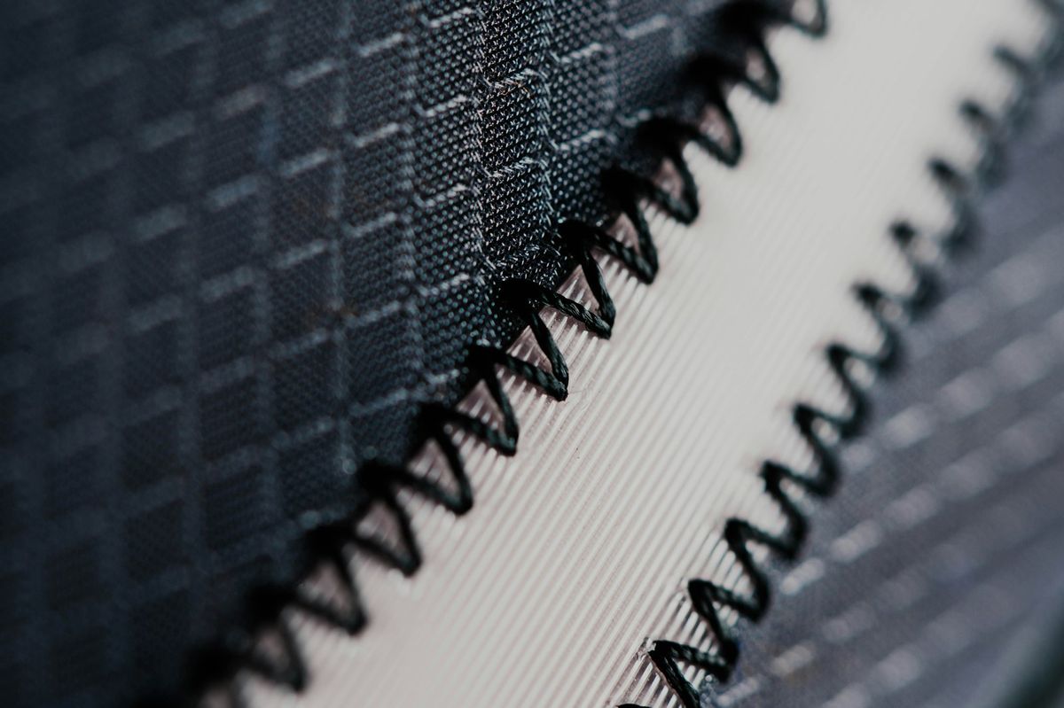 Macro detail of flat-lock stitching on cut-and-sew activewear
