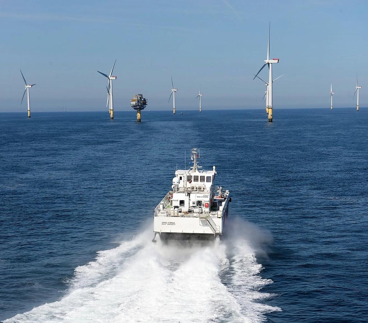 Photo of Umoe Mandal`s crew transfer vessel sailing towards an offshore wind farm
