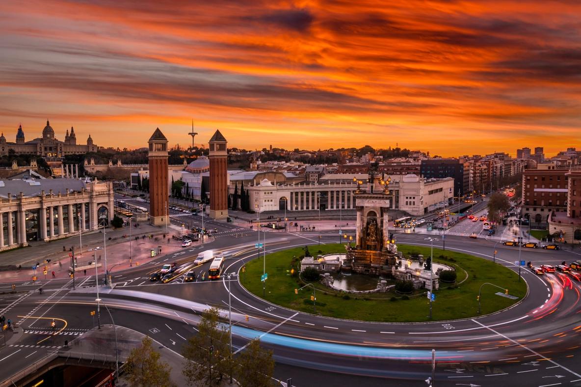 Plaça d'Espanya in Barcelona with red and orange colours of the sunset