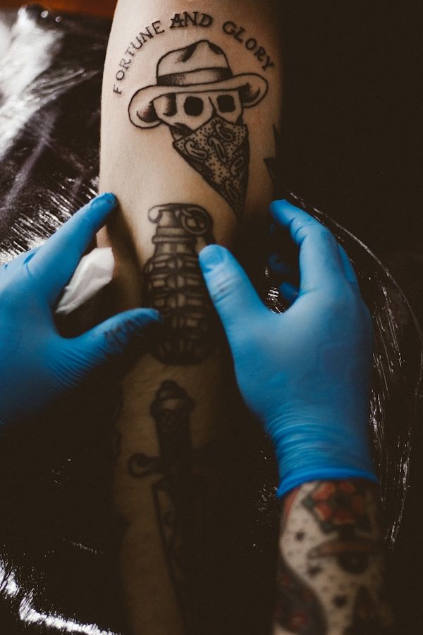Traditional tattoo being applied in studio showing bold outlines and classic flash-style design