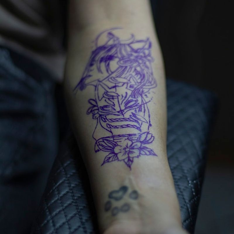 Photorealistic portrait tattoo with fine detail work on upper arm