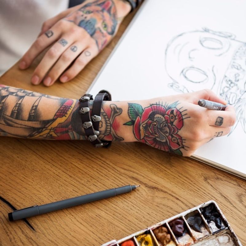 Colorful watercolor tattoo with brushstroke texture on shoulder