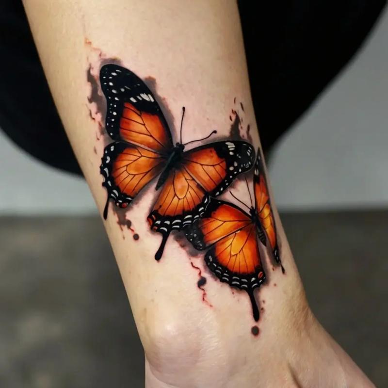 Matching butterfly tattoos with delicate line work and colour detail