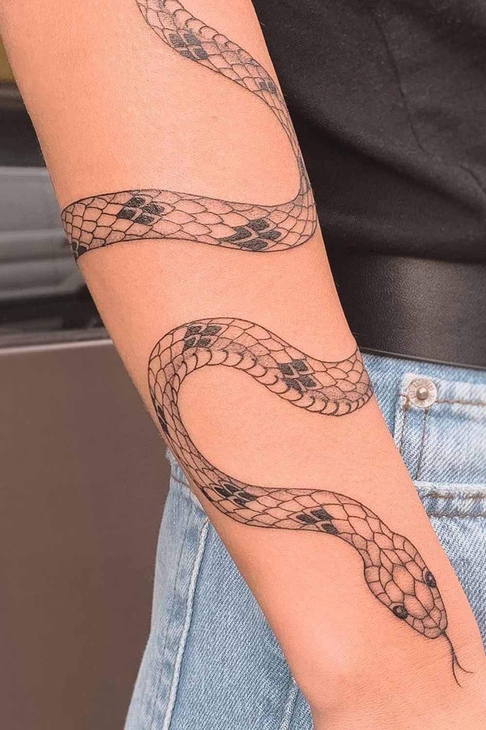 Snake bracelet tattoo design wrapping around the arm in blackwork style