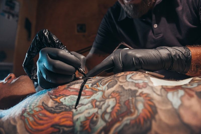 Professional tattoo artist focused on quality line work