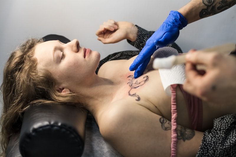 Fresh tattoo being carefully worked on by professional artist