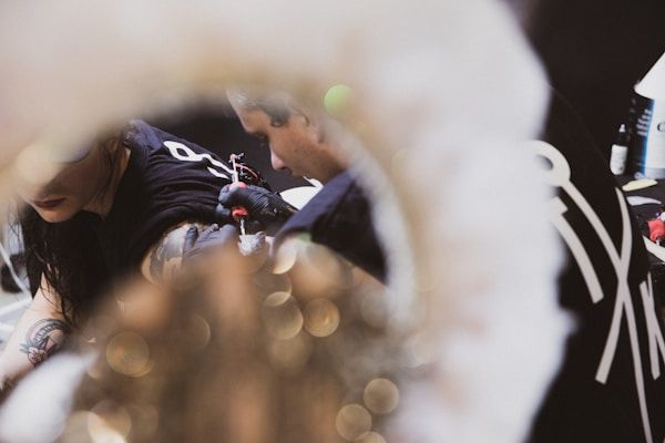 Close-up of tattoo machine technology and detailed ink application process