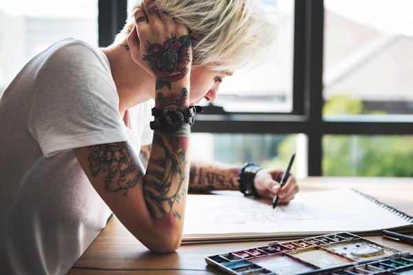 Creative watercolor tattoo design with paint splash effects