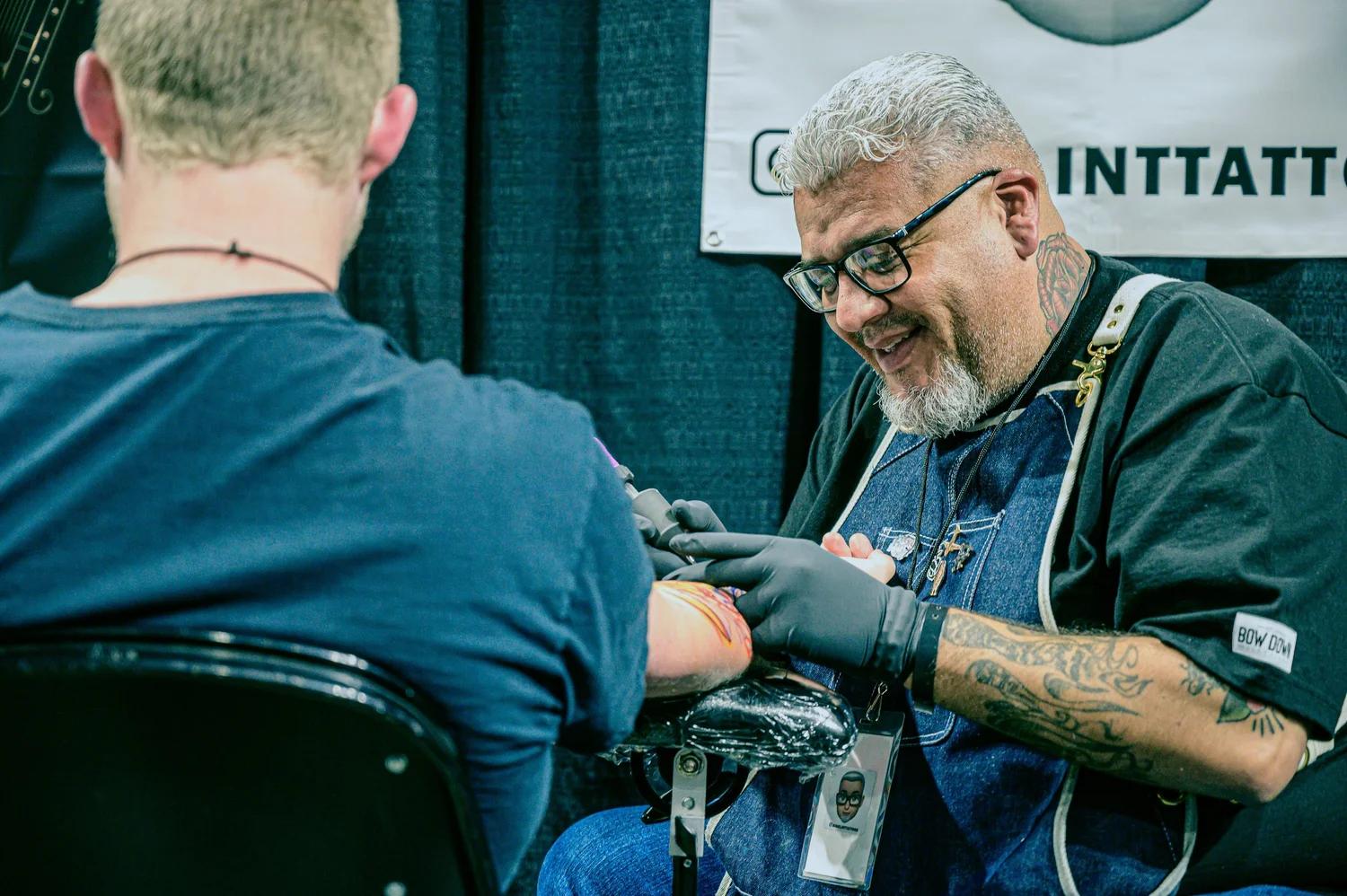 Tattoo artist working in a professional studio session
