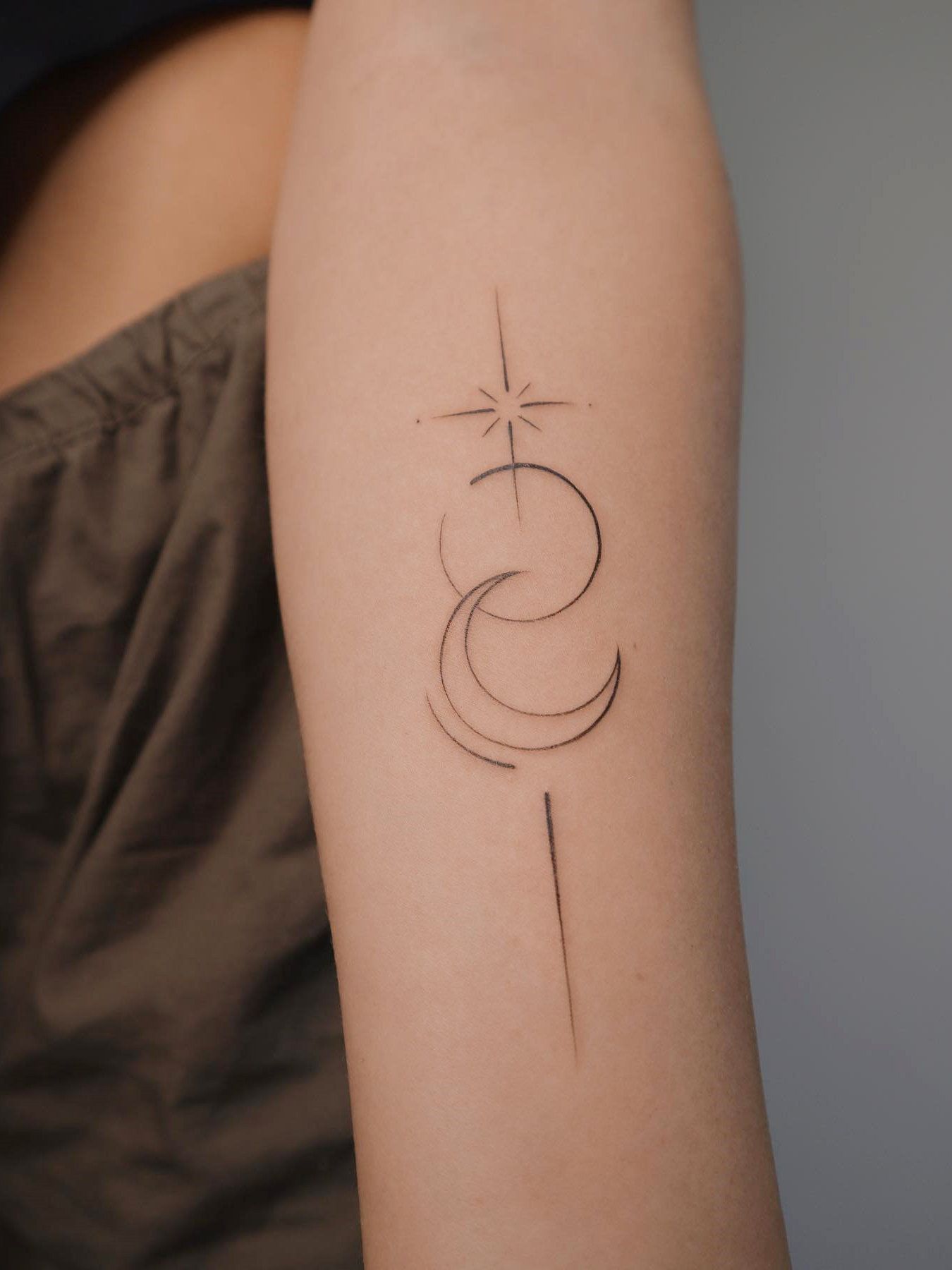Meaningful minimalist single line tattoo design on wrist
