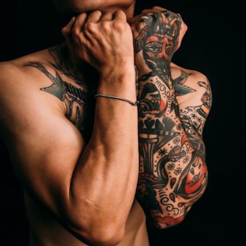 Full sleeve Japanese tattoo with bold black outlines and bokashi shading