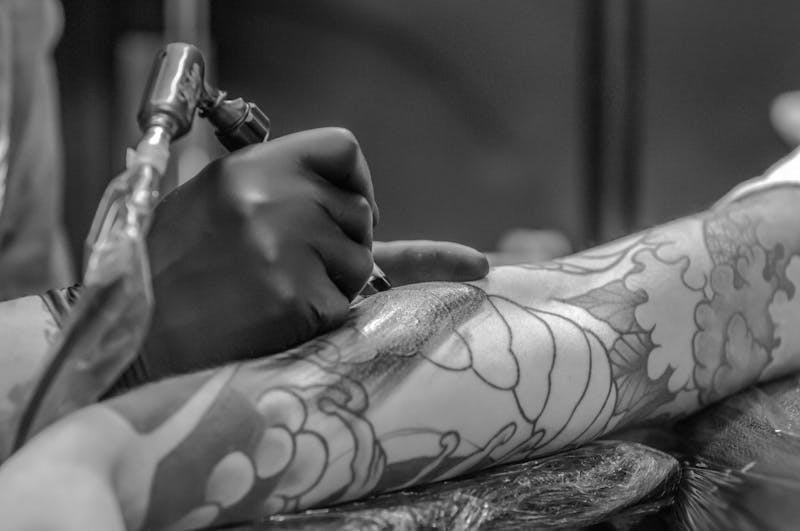 Close-up of tattooing process showing detailed needlework that represents quality worth investing in