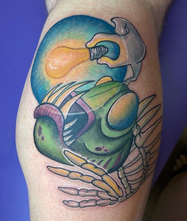 New School tattoo with bold outlines and vivid colours featuring exaggerated cartoon-style design on arm