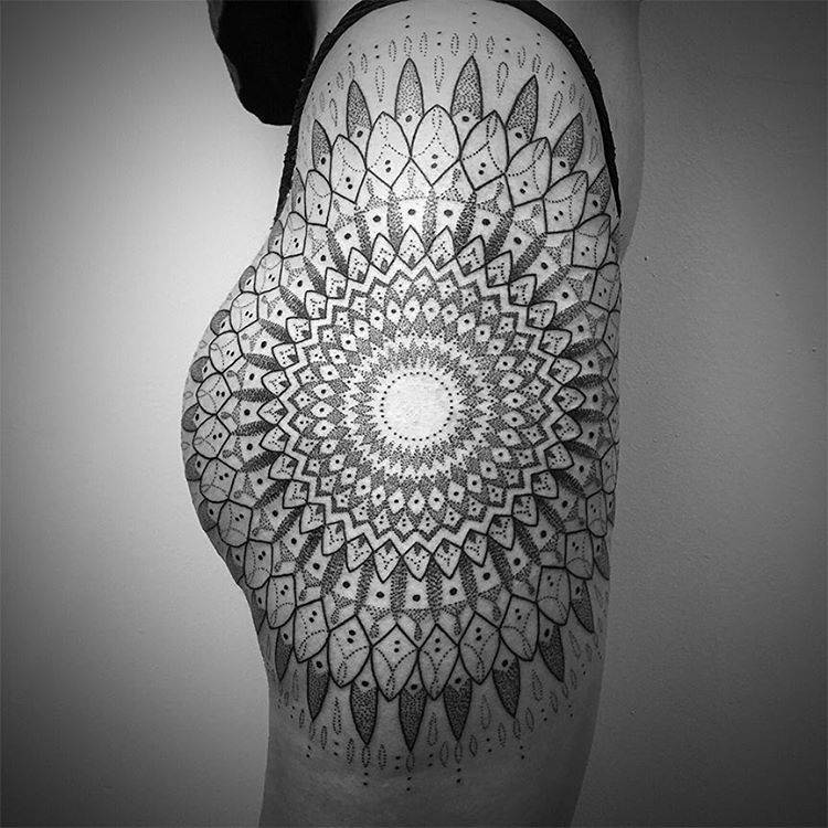 Detailed dotwork sacred geometry tattoo with fine stippling technique on shoulder
