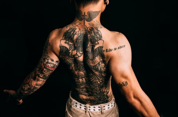 Full back tattoo showcasing large-scale body art placement across the entire back canvas