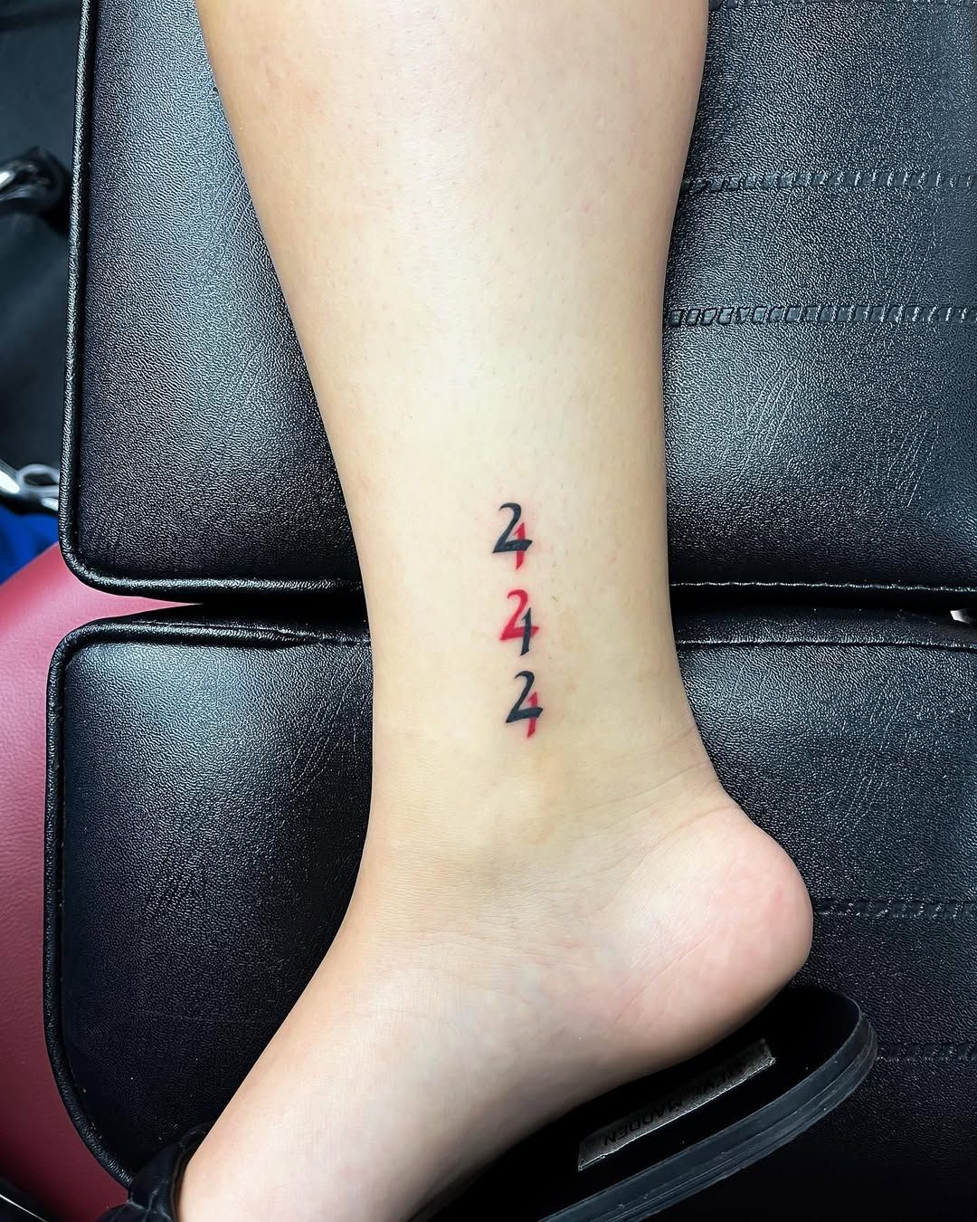 Delicate 444 angel number tattoo on ankle in minimalist style