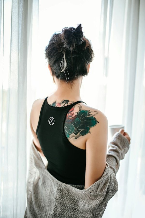 Japanese floral back piece tattoo with peony and chrysanthemum design
