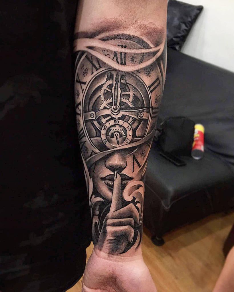 Bold forearm tattoo design with detailed linework on the outer forearm