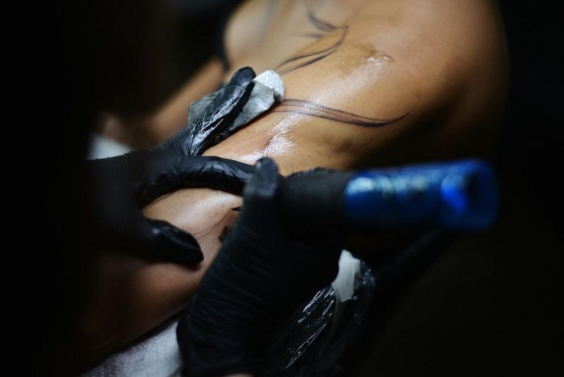 Detailed tattoo work covering previous ink on back