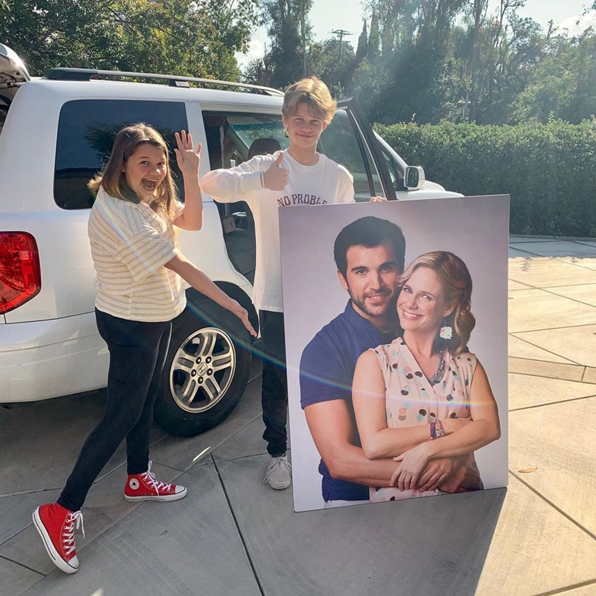 Felicity Ruth Rytky & Tate James Rytky holding andrea barber poster