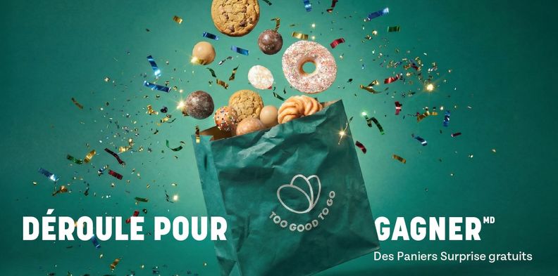 Too Good To Go bag overflowing with baked goods and confetti against a teal background. Text: DÉROULE POUR GAGNER Des Paniers Surprise gratuits.