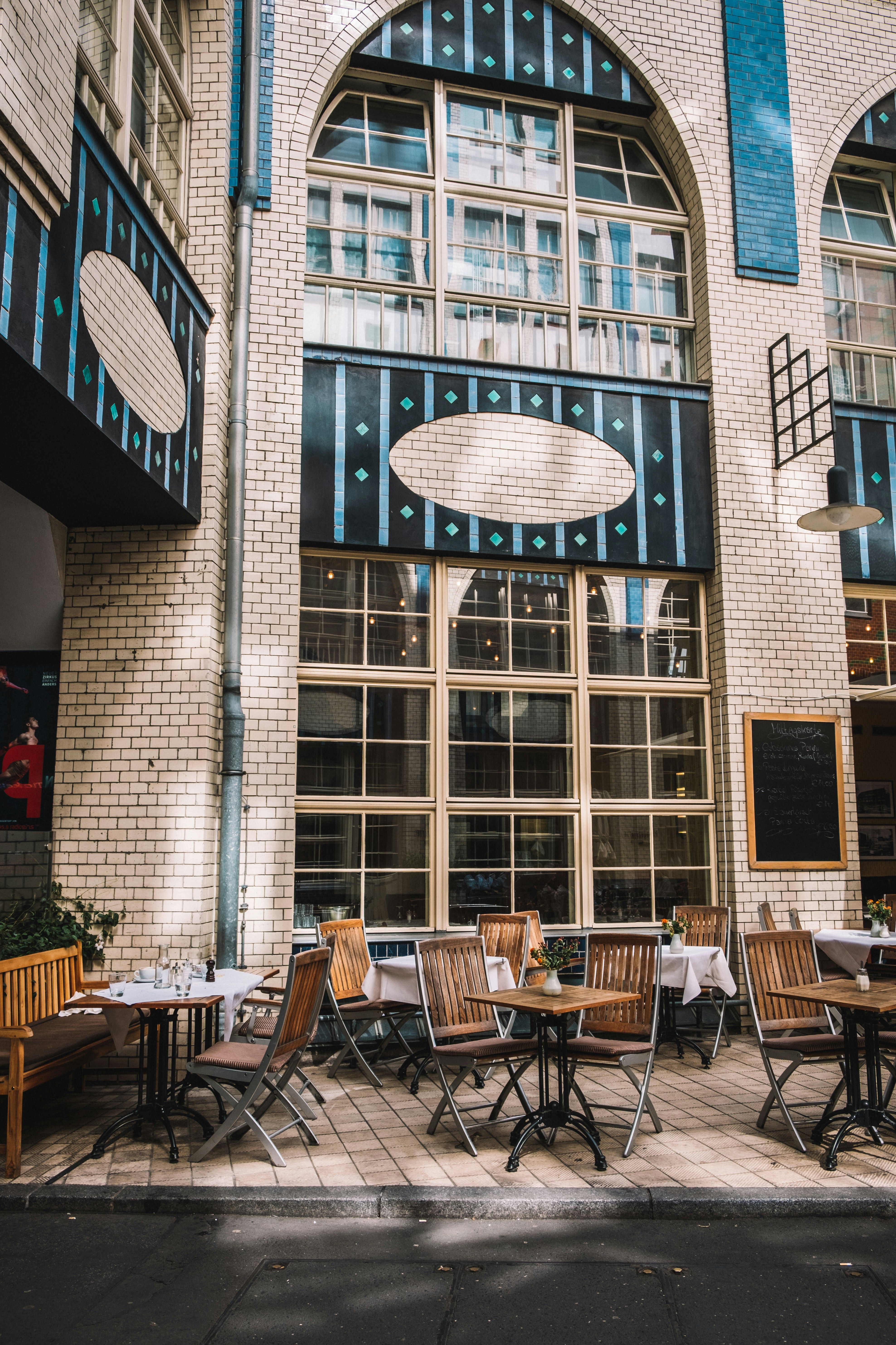 a restaurant with tables and chairs outside