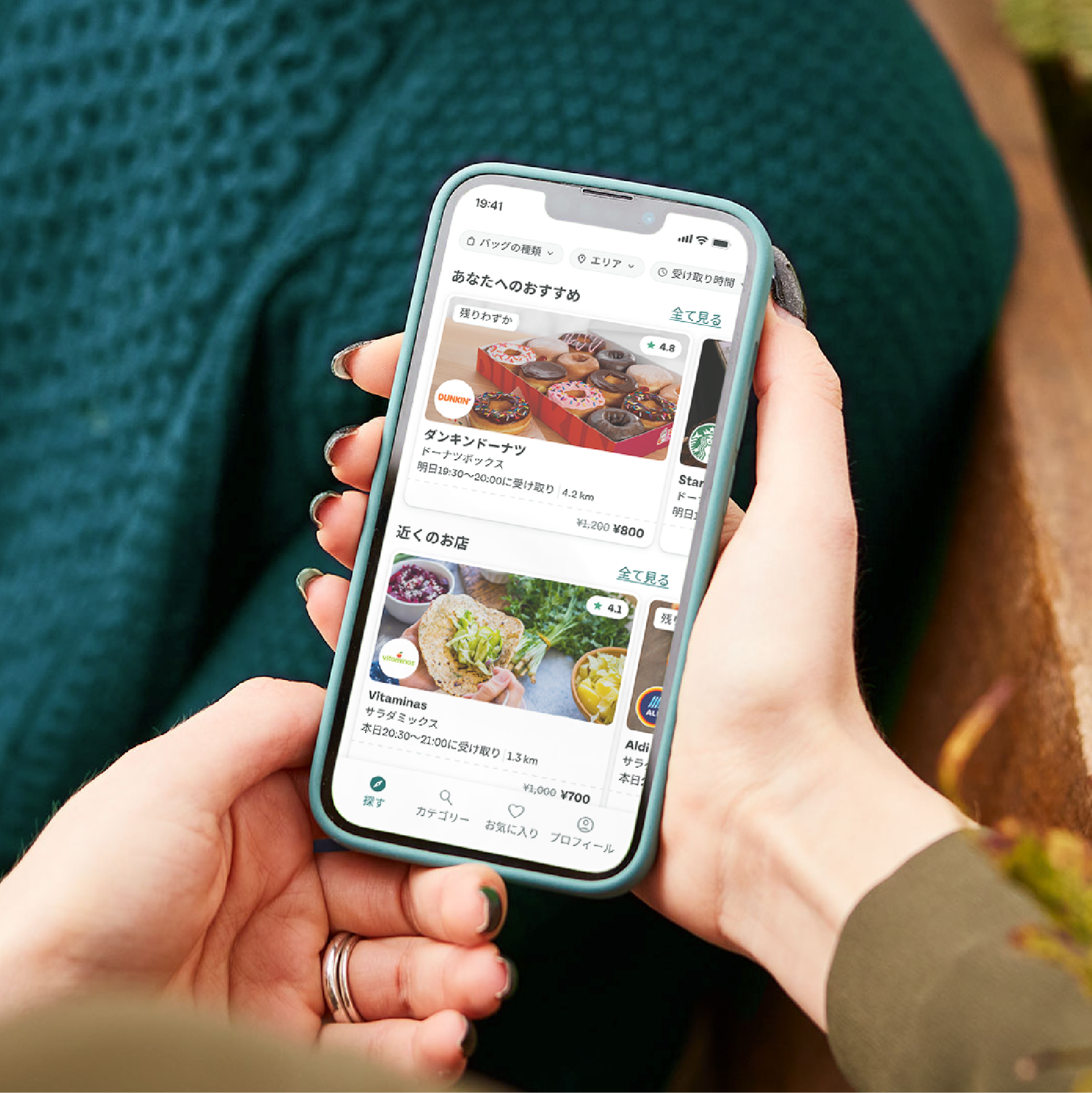 a person is holding a cell phone in their hand .