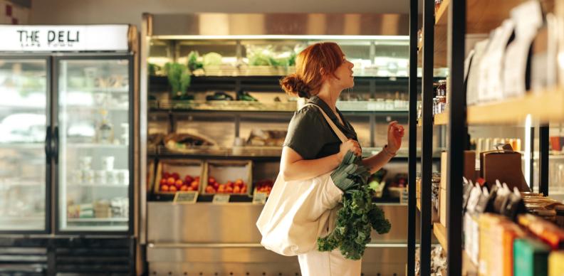 Female shopping in food retail store