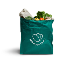 a green bag filled with fruits and vegetables says too good to go