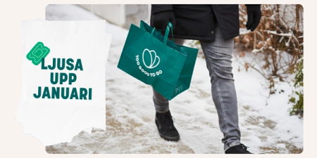 A person walks on a snowy path carrying two green "Too Good To Go" bags, with a graphic overlaid reading "LJUSA UPP JANUARI" (Brighten up January).