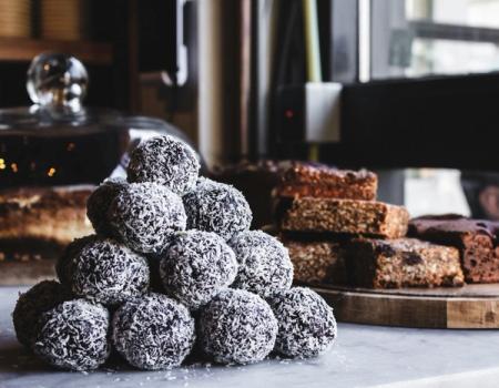 there are many different types of desserts on the table .