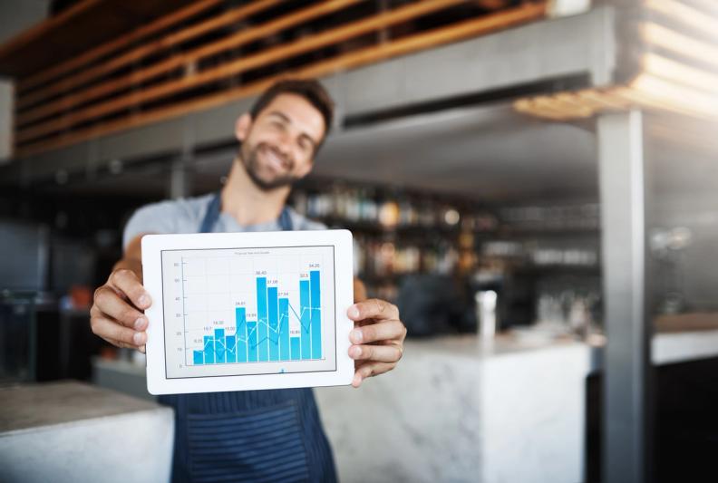 restaurant manager reviewing demand data