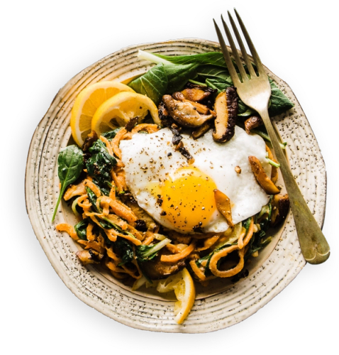 a plate of food with a fried egg on top