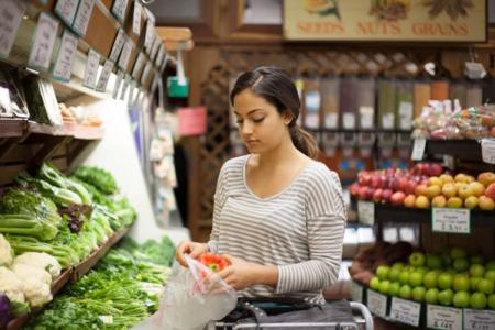 Shopper selecting fresh local produce
